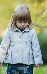 Close-up of cute girl standing outdoors