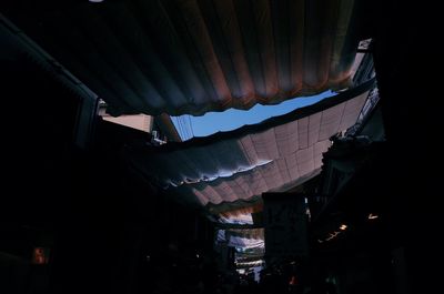 Low angle view of illuminated buildings in city at night