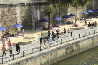 People walking on bridge over water