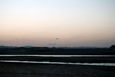 Scenic view of landscape against sky during sunset