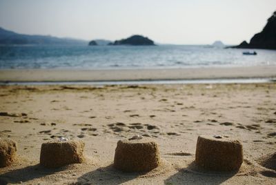 Scenic view of beach against clear sky