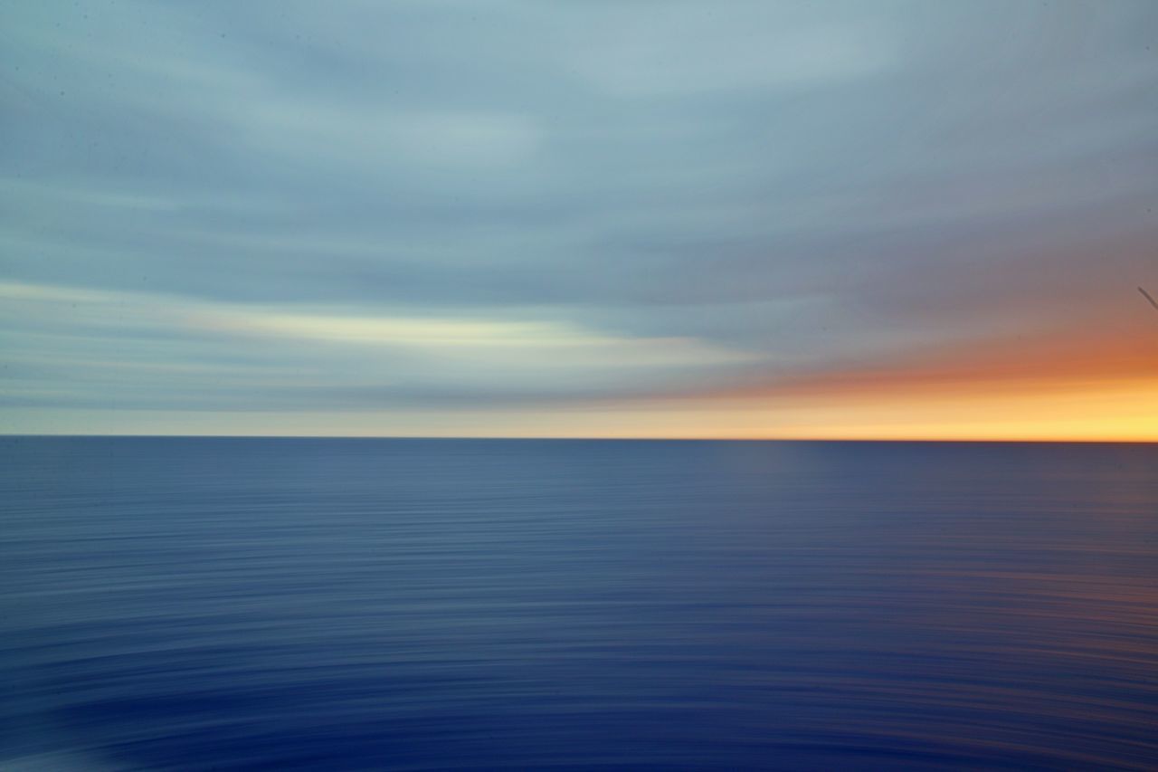 SCENIC VIEW OF SEASCAPE AGAINST SKY