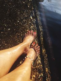 Low section of woman legs on beach