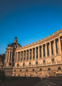 Low angle view of building against blue sky