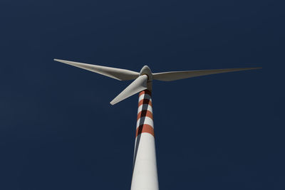 Low angle view of wind turbine against sky