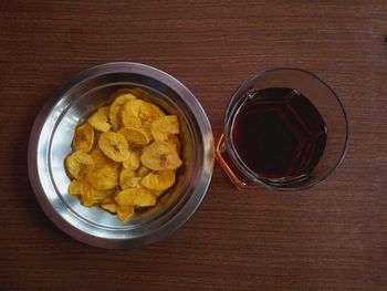 Close-up of chips with dink on table