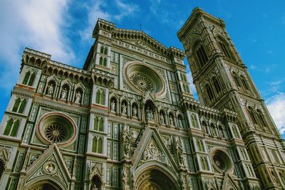 Low angle view of ornate building against sky