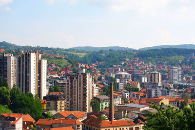 Aerial view of cityscape against sky