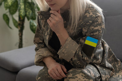 Sad military ukrainian woman in uniform