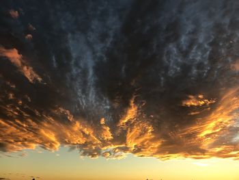 Low angle view of dramatic sky during sunset