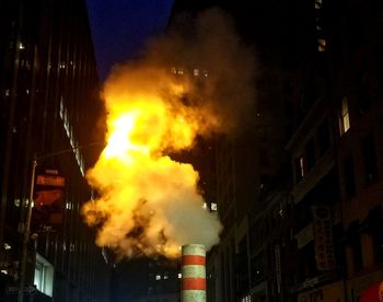 Smoke emitting from chimney against sky at night