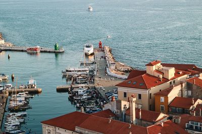 High angle view of buildings by sea