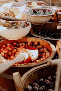 Various olives in containers for sale