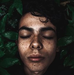 Close-up of young man with eyes closed