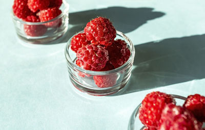 High angle view of strawberries in bowl on table