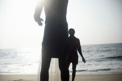 People standing on beach