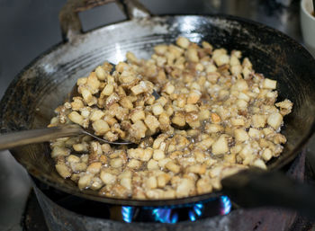 Close-up of meat in cooking pan