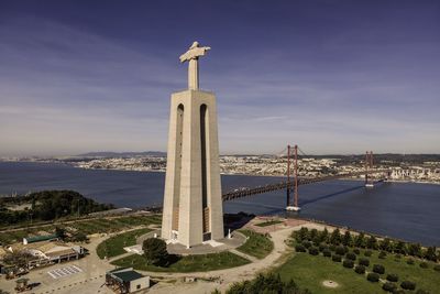 View of mosque and building against sky