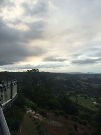 Scenic view of landscape against cloudy sky