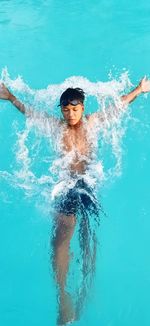 Man swimming in pool