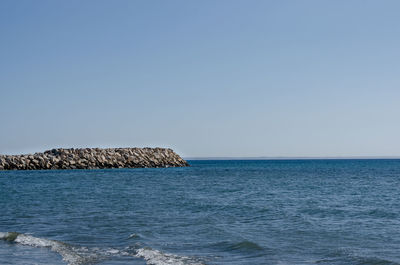 Scenic view of sea against clear sky