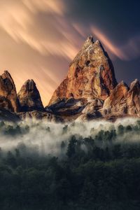 Scenic view of rocks against sky during sunset