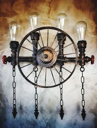 Close-up of illuminated clock hanging