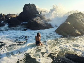 Woman standing on cliff