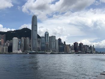 City at waterfront against sky