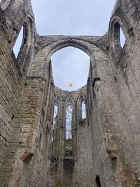 Low angle view of old building against sky