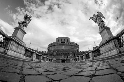 Low angle view of statue against cloudy sky