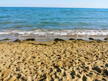 Scenic view of beach against sky