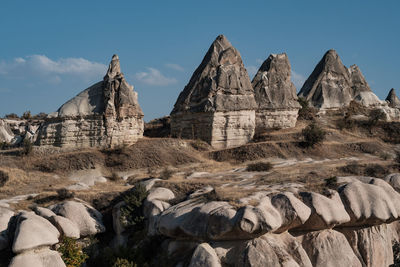Panoramic view of rocks on landscape against sky