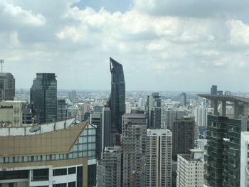 Modern buildings in city against sky