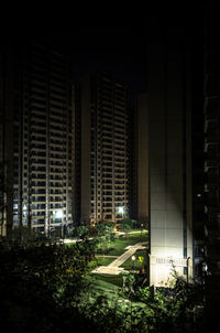 Modern buildings in city at night