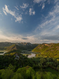 Scenic view of mountains and lake against sky