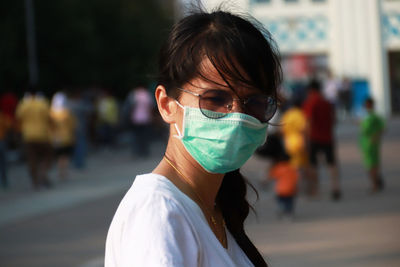 Portrait of a young woman on street