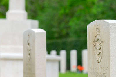 Close-up of cross in cemetery