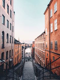 Street amidst buildings in city against sky