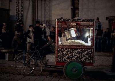 People by concession stand at night