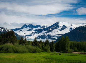 Scenic view of snowcapped mountains against sky