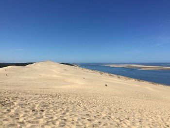 Scenic view of dune of pilat against sky