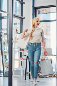 Happy woman with shopping bags