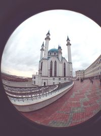 Buildings in city against sky