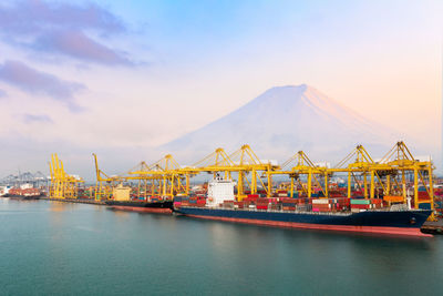 Commercial shipping port and container ship in import export and business cargo logistic, 