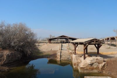 Bridge over river against clear sky