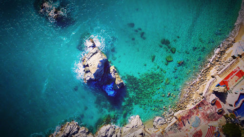 High angle view of people swimming in sea