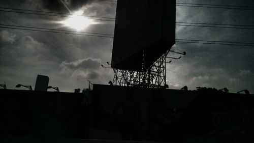 Low angle view of building against cloudy sky