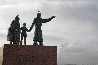 Low angle view of statue against sky