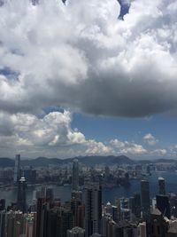 Cityscape against cloudy sky